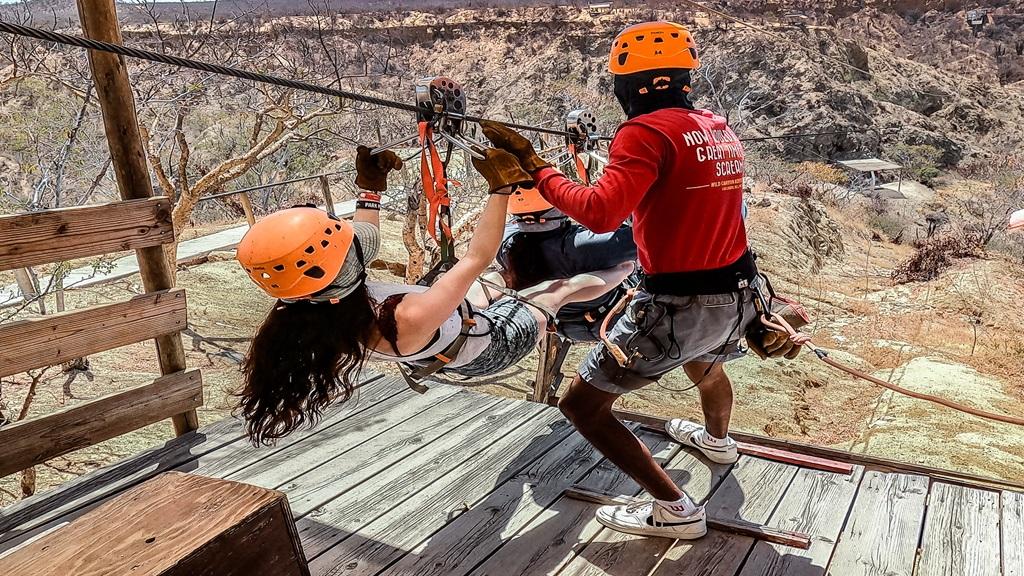 Adventure seekers on zipline experiencing offbeat activities